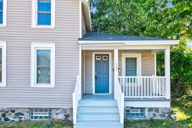 property entrance featuring covered porch