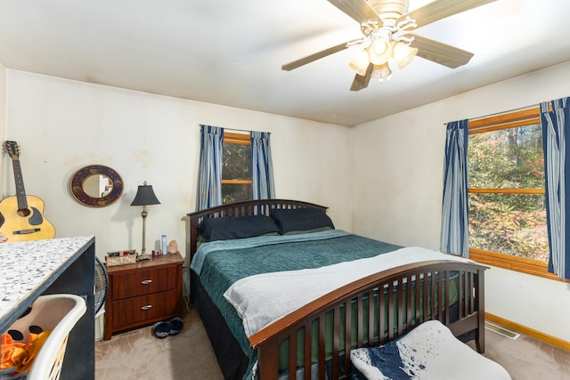 carpeted bedroom featuring ceiling fan