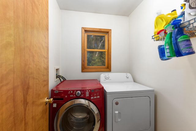 laundry room with independent washer and dryer