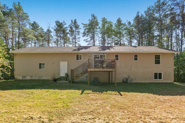 back of house with a yard, central air condition unit, and a deck