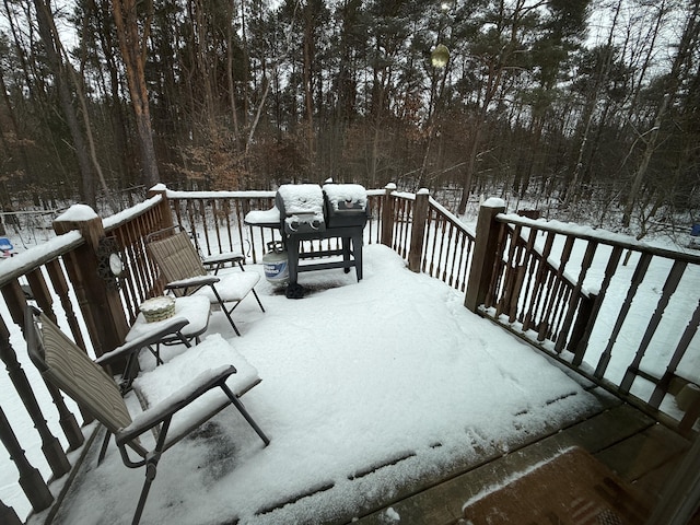 view of snow covered deck