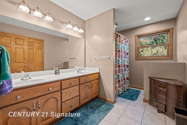 bathroom with tile patterned floors and vanity