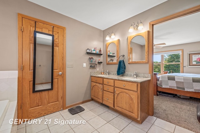 bathroom featuring tile patterned flooring, vanity, and ceiling fan