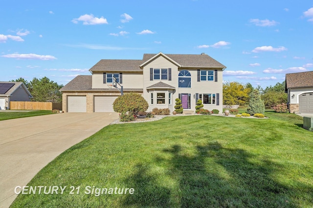 view of front of property featuring a front lawn and a garage