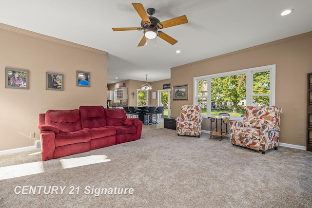 carpeted living room with ceiling fan with notable chandelier and ornamental molding