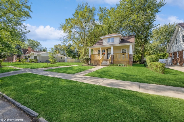 view of front facade with a front lawn and a porch