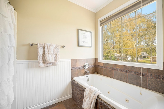 bathroom with tile patterned floors, tiled tub, and ornamental molding