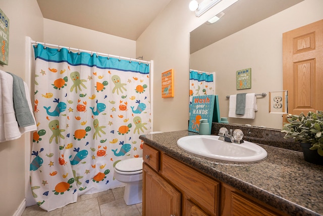 bathroom with toilet, a shower with curtain, vanity, and tile patterned floors