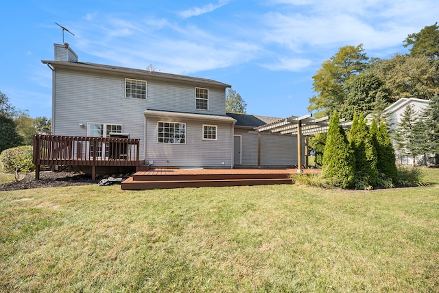 back of house with a deck, a pergola, and a yard