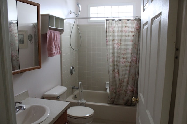 full bathroom featuring vanity, shower / bath combination with curtain, and toilet