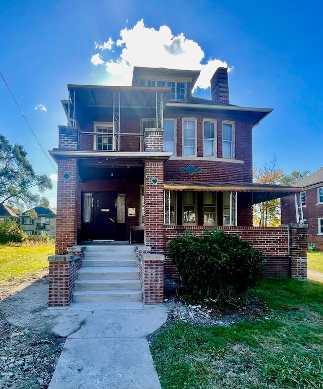 view of front of property with a balcony and covered porch