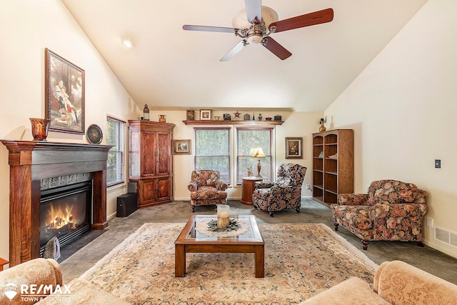 carpeted living room featuring ceiling fan and high vaulted ceiling