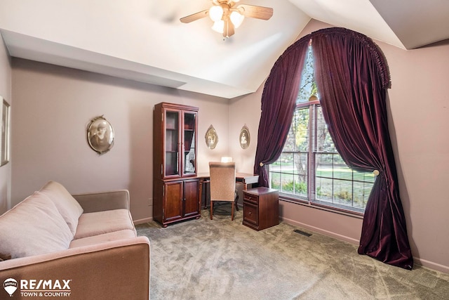 office space with light carpet, ceiling fan, and lofted ceiling