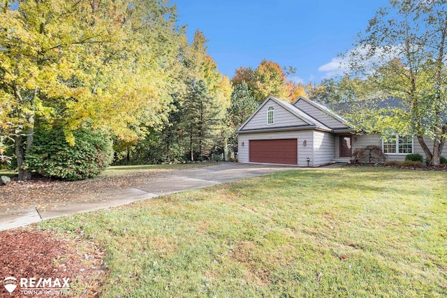 view of front of property featuring a garage and a front yard