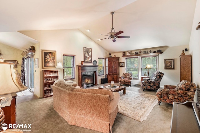 living room featuring carpet floors, high vaulted ceiling, and ceiling fan