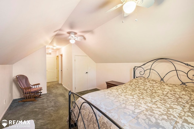 carpeted bedroom featuring ceiling fan and vaulted ceiling