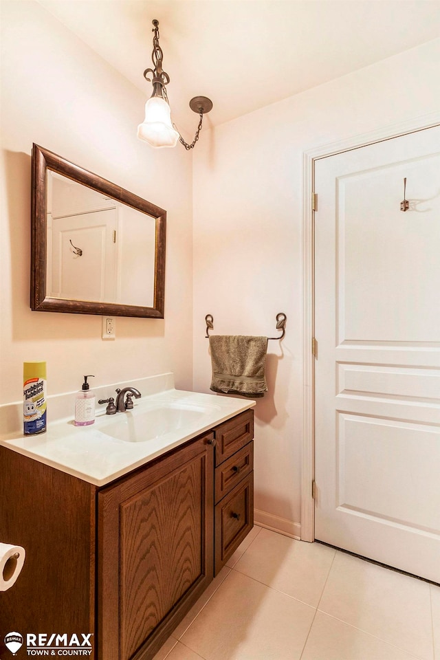 bathroom featuring tile patterned flooring and vanity