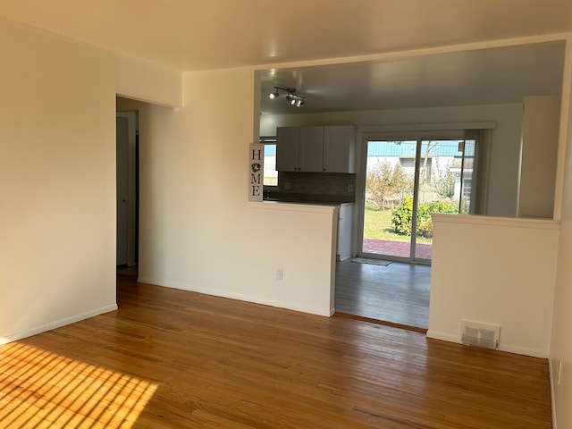 spare room featuring dark hardwood / wood-style floors