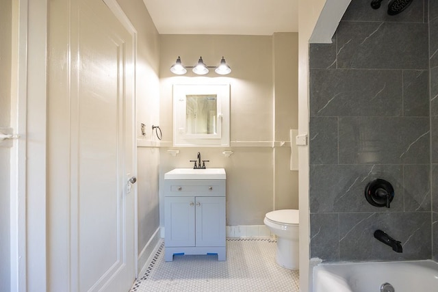 bathroom featuring tile patterned floors, vanity, and toilet