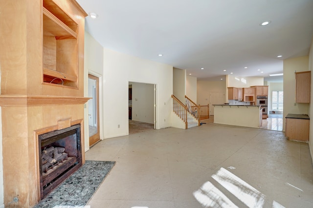 living room featuring a tiled fireplace