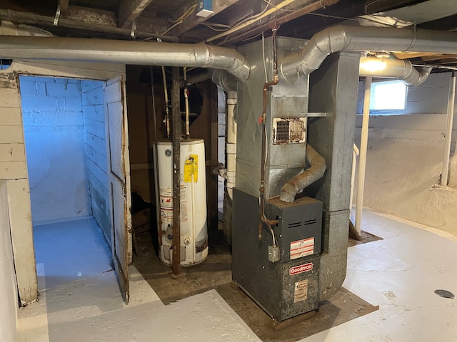 utility room with heating unit and water heater