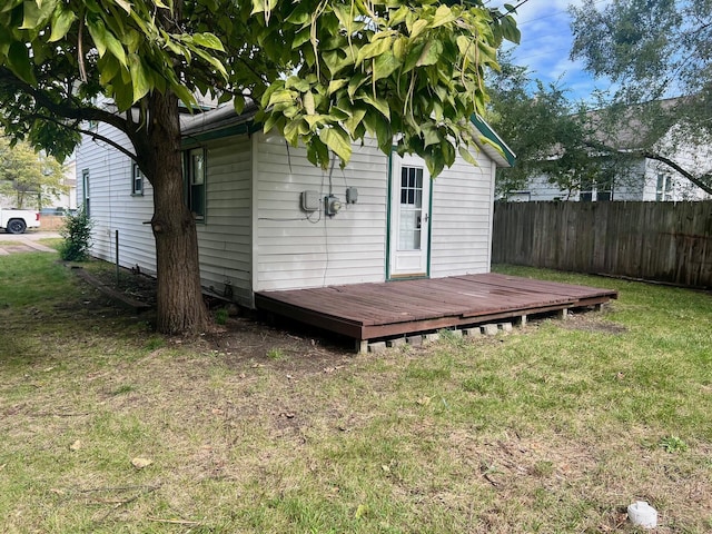 exterior space with a deck and a yard