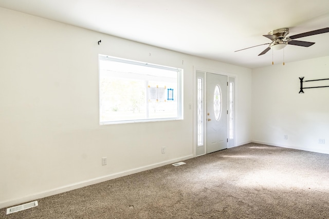 carpeted empty room with ceiling fan