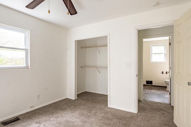 unfurnished bedroom featuring carpet flooring, a closet, and ceiling fan