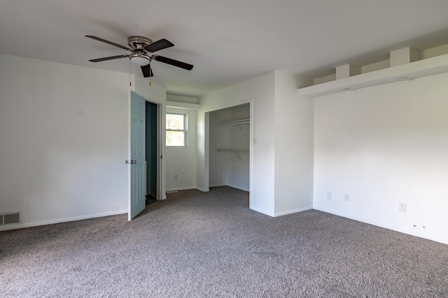 unfurnished bedroom with ceiling fan and carpet