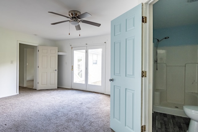 interior space featuring access to outside, ceiling fan, and ensuite bathroom