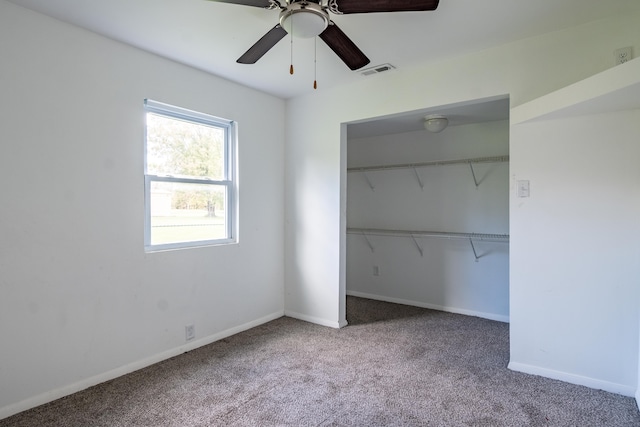 unfurnished bedroom featuring carpet flooring, a closet, and ceiling fan