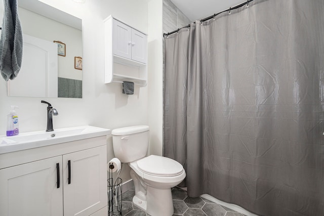 bathroom with tile patterned floors, vanity, toilet, and a shower with shower curtain