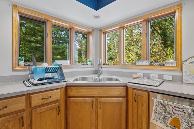 11826 Ridge View Dr, Rapid City, MI 49676 - dining space featuring a towering ceiling, a chandelier, healthy amount of natural light, and light wood-type flooring
