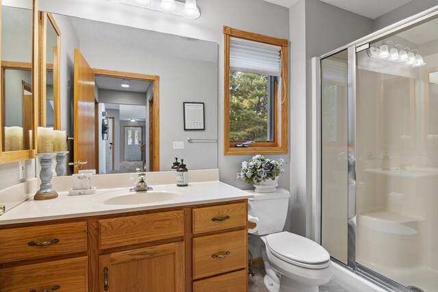11826 Ridge View Dr, Rapid City, MI 49676 - bedroom with light colored carpet, baseboards, a ceiling fan, a closet, and connected bathroom