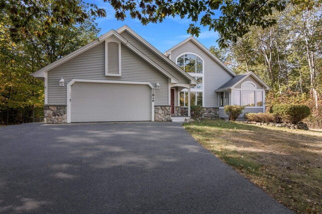 11826 Ridge View Dr, Rapid City, MI 49676 - view of subject property with a heavily wooded area