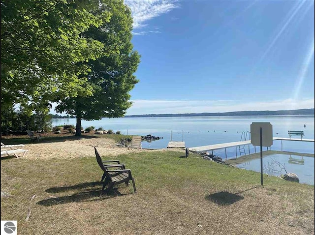 11826 Ridge View Dr, Rapid City, MI 49676 - view of property's community with a water view and a yard