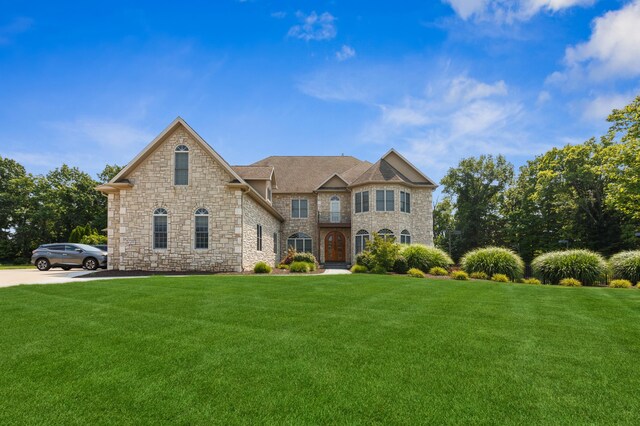 4559 Trails End Path, Saint Joseph, MI 49085 - french country home featuring stone siding and a front lawn