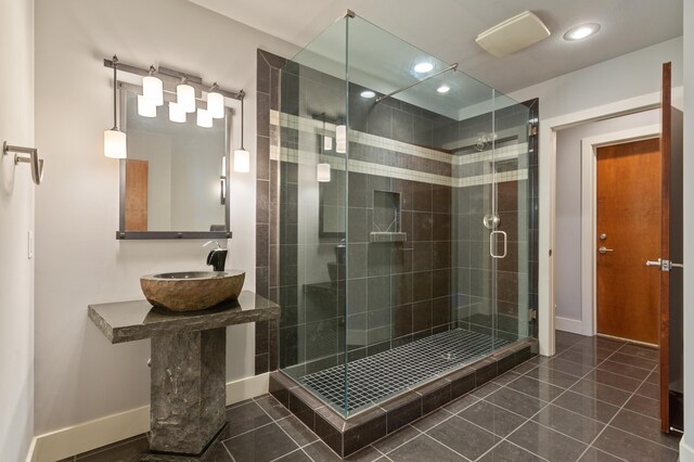 4559 Trails End Path, Saint Joseph, MI 49085 - full bath with a sink, tile patterned flooring, a shower stall, recessed lighting, and baseboards