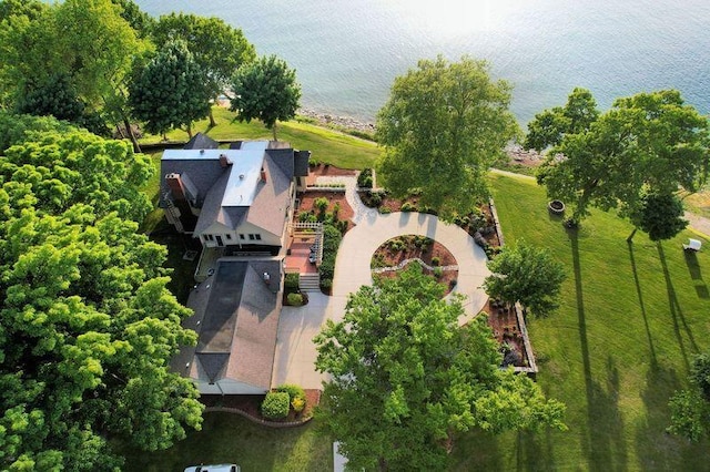 birds eye view of property with a water view