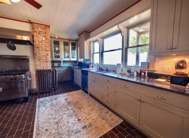 kitchen featuring light stone counters, sink, and stainless steel appliances