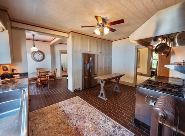 kitchen with ceiling fan, stainless steel appliances, decorative light fixtures, and ornamental molding