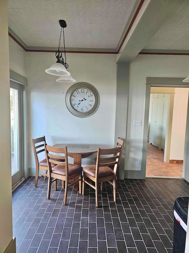 dining space featuring ornamental molding