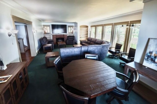 living room featuring dark colored carpet, crown molding, and a fireplace