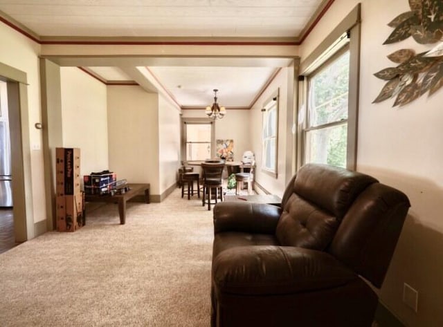 living room with light carpet, a chandelier, and ornamental molding