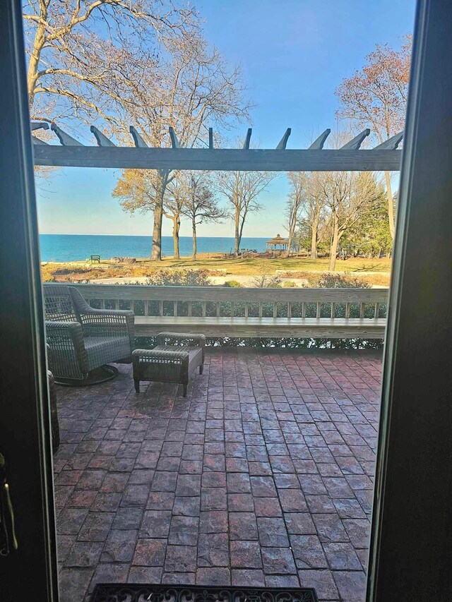 view of patio featuring a water view