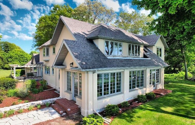 rear view of house with a lawn