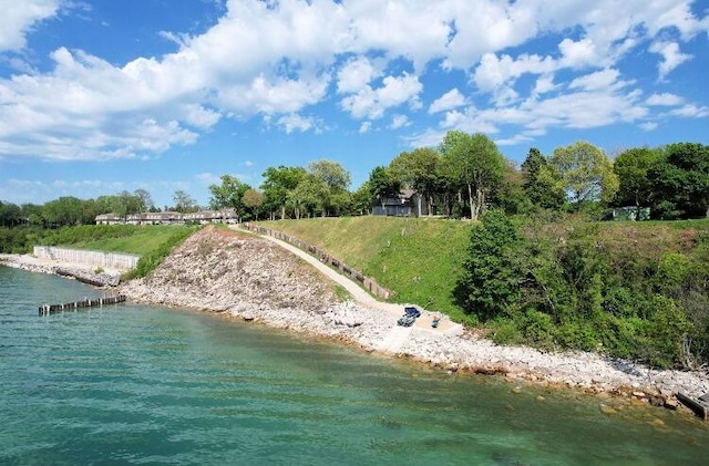 birds eye view of property featuring a water view