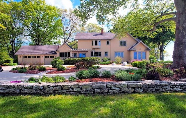 mediterranean / spanish house featuring a garage