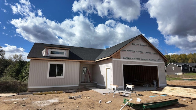 property in mid-construction with a garage