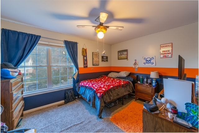 carpeted bedroom featuring ceiling fan